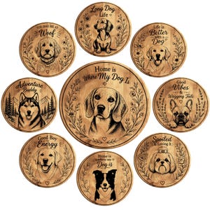 May include: A collection of wooden dog-themed decorative signs. Each sign features a different dog breed illustration and a related phrase, such as "Long Dog Life" or "Home is Where My Dog Is". The signs are round and have a rustic, engraved appearance.