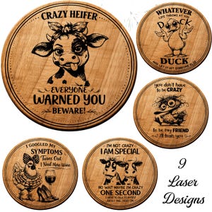 May include: Nine laser-engraved wooden signs with humorous designs. One sign features a cow with text "Crazy Heifer." Another shows a duck with sunglasses and the text "Duck." Other signs have various funny sayings.
