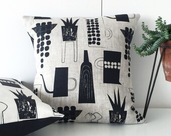 Botanics and ceramics cushion on natural linen