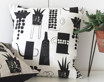 Botanics and ceramics cushion on white linen union