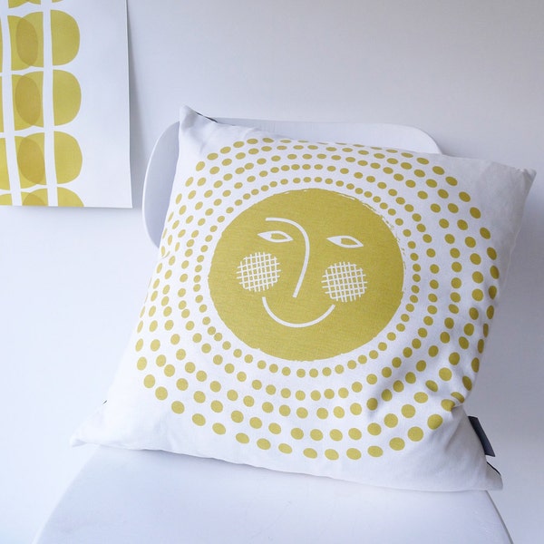 sun spots cushion on white linen