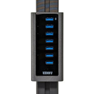 May include: A black USB hub with seven blue USB ports and the word "ANKER" printed on the front.