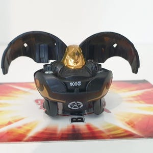 Bakugan Ravenoid 600g Bakugold Bronze Attack Gray Haos BATTLE BRAWLERS Rare - Free SHIPPING