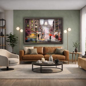 May include: A framed oil painting depicts a Parisian street scene with the Eiffel Tower in the background. The artwork features figures with umbrellas, streetlights, and buildings in shades of brown, red, and gray. The painting hangs above a brown leather sofa.