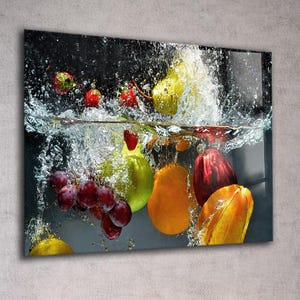 May include: A vibrant image of various fruits submerged in water, creating a splash effect. The composition includes red strawberries, green pears, purple grapes, and orange and yellow fruits. The water droplets add a dynamic element.