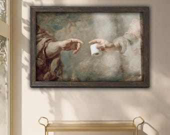 May include: Framed art print depicting a humorous parody of Michelangelo's 'The Creation of Adam.' The artwork features two hands reaching out, one offering a roll of toilet paper. The print is in a dark wooden frame.