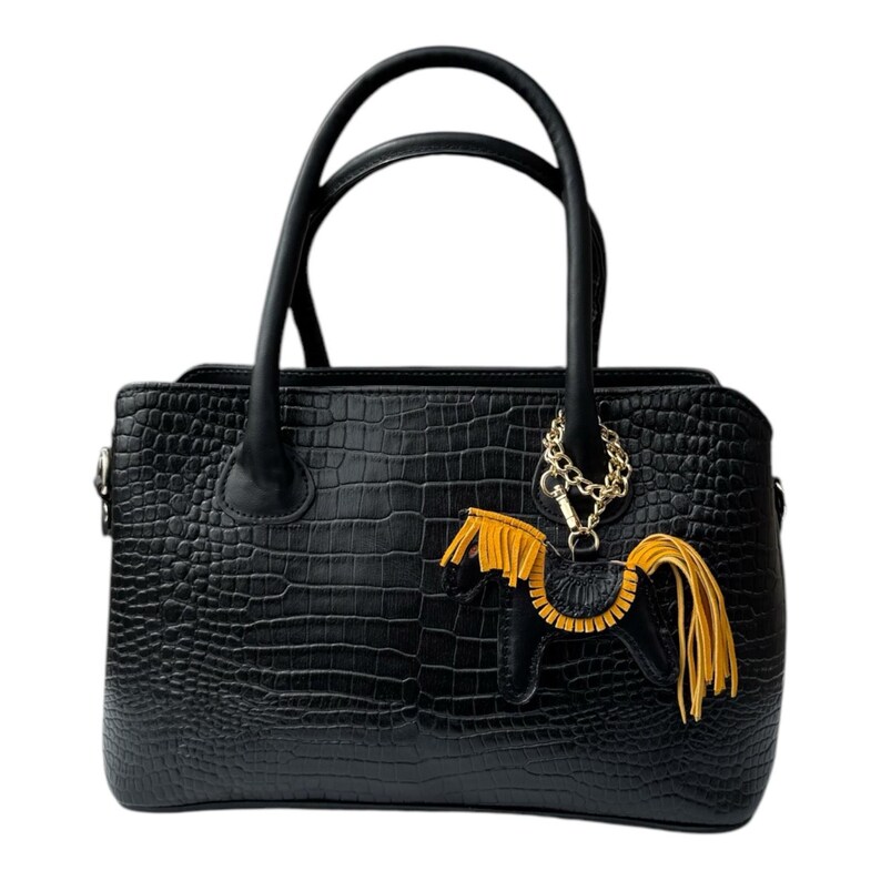 May include: Black leather handbag with a crocodile embossed pattern and a gold chain with a yellow tassel charm.
