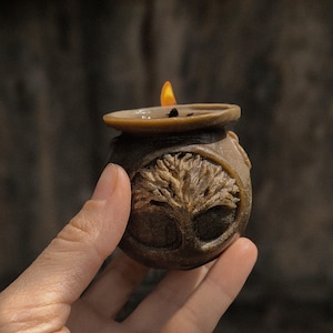 a witch&#39;s vat with a tree of life candle Natural beeswax