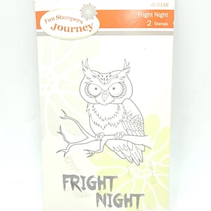 May include: A rectangular Fun Stampers Journey Fright Night stamp set package featuring a line art illustration of an owl perched on a branch. The white packaging includes the text Fright Night, AT-0148, and 2 Stamps in orange and grey.