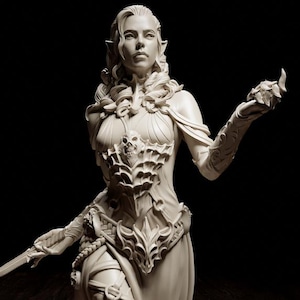 May include: A detailed, off-white fantasy figurine of a woman in a flowing gown, holding a dagger and a small object. The figure stands on a black base, with a large, yellow, multi-sided die nearby. The figurine's design includes intricate armor and flowing fabric.