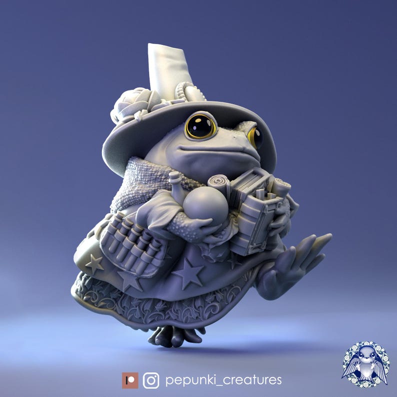 May include: A gray 3D printed figurine of a frog wearing a large hat with a white plume, a robe, and holding a book and a ball. The frog has large, round, yellow eyes.