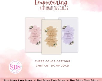 May include: Printable PDF affirmation cards with three color options: pink, beige, and purple. Each card features a watercolor background with white flowers and an empowering affirmation. The affirmations are: "I have the power to change my story", "I have the power to change my story", and "I am powerful, confident, and capable".