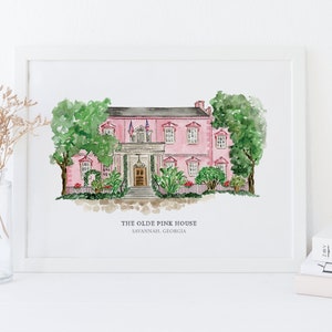May include: A watercolor painting of a pink house with white trim and green trees. The house has a white picket fence and a porch with a door. The text "THE OLDE PINK HOUSE SAVANNAH, GEORGIA" is below the house.