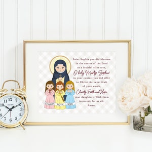 May include: A framed print with a white background and a checkered pattern. The print features a cartoon illustration of Saint Sophia and her three daughters, Charity, Faith, and Hope. The text reads: "Saint Sophia you did blossom in the courts of the Lord as a fruitful olive tree, O holy Martyr Sophia in your contest you did offer to Christ the sweet fruit of your womb, Charity Faith and Hope your daughters. With them intercede for us all. Amen."