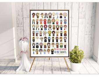 May include: A colorful poster featuring illustrations of various saints. The poster has a white background and includes the quote "Do not be afraid to be saints."  Saint John Paul II.