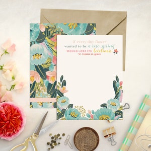 May include: A floral-patterned card with a quote about spring: "If every tiny flower wanted to be a rose, spring would lose its loveliness." -  St. Therese of Lisieux.