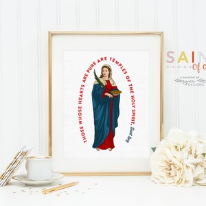 May include: A printable art print featuring a saint with a quote in red text: "Those whose hearts are pure are temples of the Holy Spirit, Saint Jugy". The print is framed in gold and has a white background.