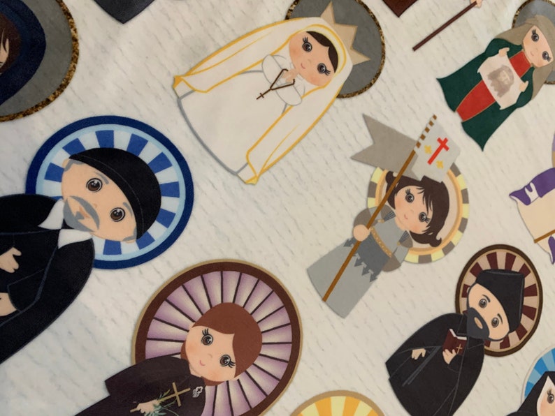 May include: A collection of colorful paper cutouts depicting various religious figures. Each figure is surrounded by a decorative halo and features a unique design. The figures include a woman in a white veil, a man in a black robe, a woman in a blue robe, and a man in a gray robe.