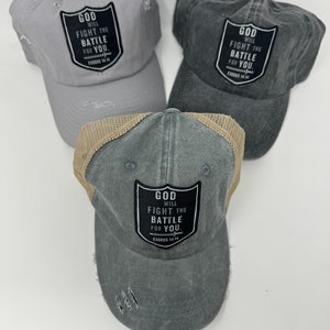 May include: Three distressed baseball caps with a mesh back. Each cap features a black patch with the text "GOD WILL FIGHT THE BATTLE FOR YOU. EXODUS 14:14".