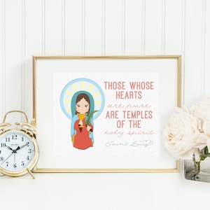 May include: A framed print with a gold frame featuring an illustration of Saint Lucy holding a palm branch and chalice. The print includes the text "THOSE WHOSE HEARTS are pure ARE TEMPLES OF THE holy spirit Saint Lucy." A gold alarm clock and a vase of white flowers are also visible.