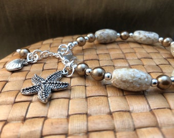 SALE: Bracelet with Mother of Pearl and Resin Sand Colored Beads, Bronze Glass Pearls, and Silver Plated Starfish and Scallop Charms