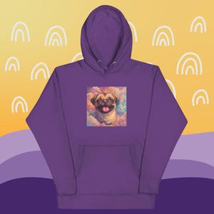 May include: Purple hoodie with a graphic of a pug wearing a crown and surrounded by clouds. The pug is looking at the viewer and has its tongue sticking out.