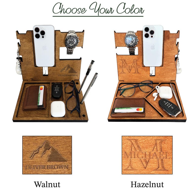 May include: Two wooden phone and watch stands with different wood finishes. The stand on the left has a mountain design and the text "Oliver Brown". The stand on the right has the text "Michael" engraved on it. The stands are labeled "Walnut" and "Hazelnut".