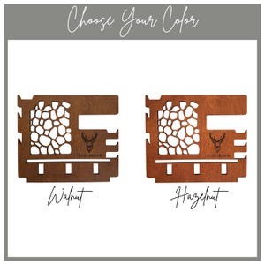 May include: Two wooden wall-mounted organizers with a cutout giraffe pattern, a deer head icon, and the text 'LUCAS BROWN'. One is dark walnut brown and the other is a lighter hazelnut brown. Both feature side notches and bottom hooks for storage.