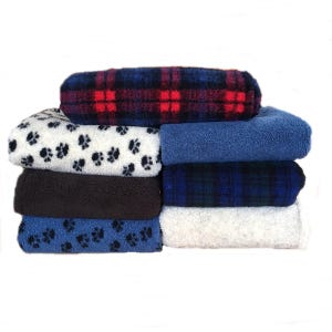 May include: A stack of eight fleece blankets in various patterns, including paw prints, plaid and solid colours. The blankets are folded and stacked on top of each other.
