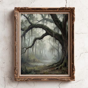 May include: An antique-style framed print of a swamp scene. The artwork depicts a large, gnarled tree with Spanish moss hanging from its branches, set against a misty forest backdrop. The frame is ornate with a gold finish.