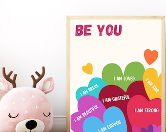 Peut inclure: Une affiche de motivation avec le texte "BE YOU" en lettres roses. L'affiche présente un arc-en-ciel de cœurs avec des affirmations positives, telles que "Je suis aimé", "Je suis gentil" et "Je suis assez".