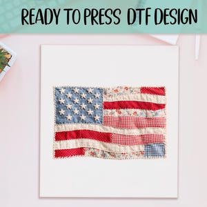 May include: A fabric American flag design with a patchwork style. The flag features a blue field with white stars and red and white stripes. The text "READY TO PRESS DTF DESIGN" is at the top.