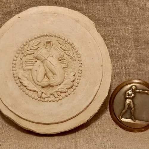 2 antique French boxing medallions. Plaster medallion of boxing gloves