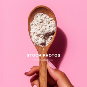 May include: A wooden spoon filled with a white powder, held by a hand against a pink background. The text "STOCK PHOTOS BY DIGITAL STOCK BOSS" is printed below the spoon.