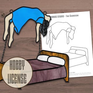 May include: A stained glass art piece depicting a figure in a blue shirt arching above a bed with a purple quilt and two white pillows. The piece includes black metal chains and a paper pattern sheet labeled HANDS STUDIO - THE EXORCISM and HOBBY LICENSE.