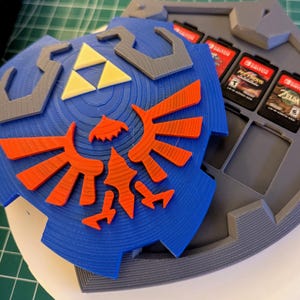 ゼルダをテーマにしたスイッチカートリッジホルダー ゼルダの伝説 リンクのハイリアの盾をテーマにしたニンテンドースイッチカートリッジホルダー ブレスオブザワイルド
