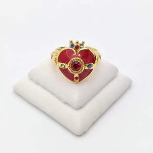 Elegant Vintage Gold Tone Cuff Ring with Red Heart Enamel, Crown Accents, and Multicolor Gemstones; Adjustable Statement Jewelry.