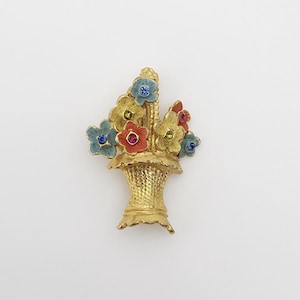 Vintage gold-tone flower basket brooch with colorful enamel blooms and rhinestone centers, elegant and whimsical mid-century jewelry.
