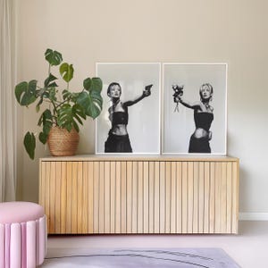 CHOICES Poster Set of 2 — black and white fashion wall art featuring a bold model holding a gun in one print and roses in the other, symbolizing duality, peace vs chaos. Minimalist chic and editorial, this set of 2 prints brings It-girl energy, femme fatale glamour, and main character vibes to any dorm room, apartment, or gallery wall. Perfect statement art for Gen Z, millennials, and modern cool-girl interiors.