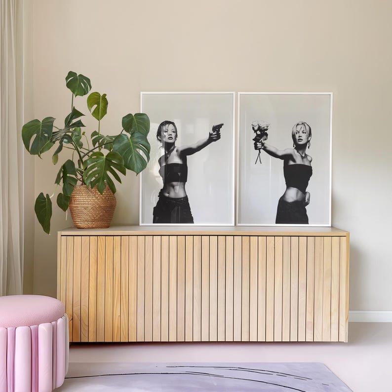 CHOICES Poster Set of 2 — black and white fashion wall art featuring a bold model holding a gun in one print and roses in the other, symbolizing duality, peace vs chaos. Minimalist chic and editorial, this set of 2 prints brings It-girl energy, femme fatale glamour, and main character vibes to any dorm room, apartment, or gallery wall. Perfect statement art for Gen Z, millennials, and modern cool-girl interiors.