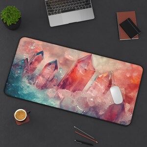 May include: A colorful mousepad featuring a close-up of pink, red, and white crystals. The crystals are arranged in a cluster and appear to be glowing.