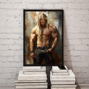 May include: A framed art print depicting a muscular male figure with long blonde hair, wearing dark trousers and a belt. The artwork has a painted style with a neutral colour palette, set against a textured background. The print is displayed on a stack of white books.