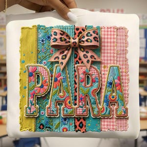 May include: A white square pillow with the word "PARA" in colorful floral letters. A pink and leopard print bow sits above the letters. The background has vertical stripes of yellow, blue, and pink. The text "9 FREE DESIGNS INCLUDED!" is at the bottom.
