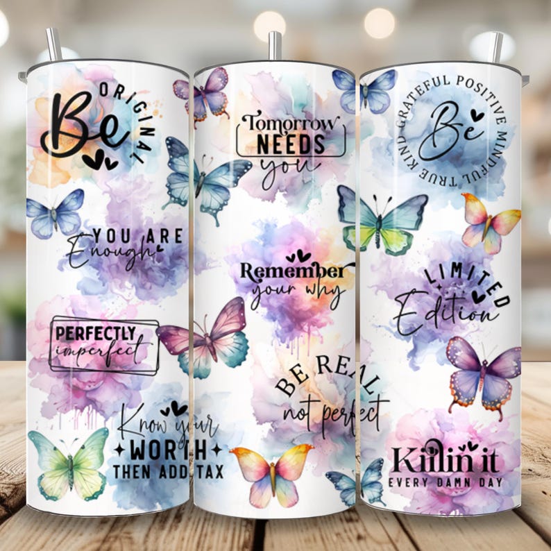Op de afbeelding: Drie roestvrijstalen bekers met kleurrijke aquarel-vlinderontwerpen en inspirerende citaten. De citaten zijn: "Be Original", "Tomorrow Needs You", "Be True, Be Kind, Be Mindful", "You Are Enough", "Perfectly Imperfect", "Remember Your Why", "Be Real Not Perfect", "Limited Edition", "Know Your Worth Then Add Tax" en "Killin It Every Damn Day".