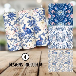 May include: Three stainless steel tumblers with blue floral and rabbit designs, accented with pink bows. The tumblers feature a classic toile pattern. Four designs are included. The tumblers are on a wooden surface.