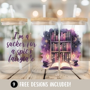May include: Three clear glass tumblers with a wooden lid and a straw. The tumblers have different designs. One tumbler has the text "I'm a sucker for a spicy fairytale". Another tumbler has a design of a bookshelf with books and candles. The third tumbler has a design of a bookshelf with books and candles.