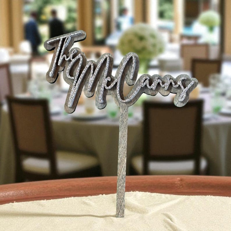 A decorative name tag on a table, with the name "McCann" written on it.