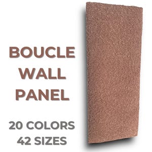 May include: A brown boucle wall panel. The panel is textured and has a subtle sheen. The text "BOUCLE WALL PANEL 20 COLORS 42 SIZES" is printed below the panel.