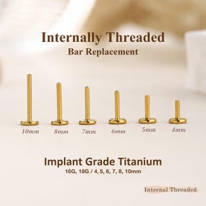 May include: Six gold-colored internally threaded bar replacements for body jewelry, arranged by height. The bars are labeled 10mm, 8mm, 7mm, 6mm, 5mm, and 4mm. Text reads: Internally Threaded Bar Replacement, Implant Grade Titanium, 16G, 18G.