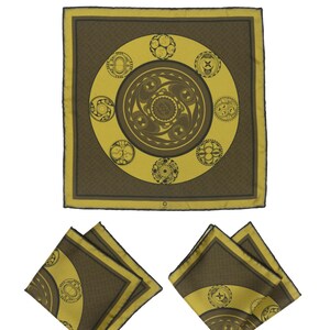 May include: A yellow pocket square with a brown geometric pattern. The pattern features a circle with smaller circles inside. The pocket square is folded into a triangle shape.